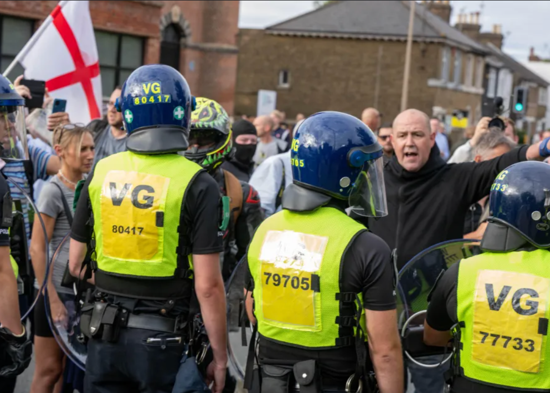 Essex Police bussing claims, Epping migrant hotel protest, counter-protest escort denial, unrest Bell Hotel Essex, Nigel Farage Essex Police controversy.